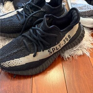 Yeezy Black and Cream Athletic Shoes